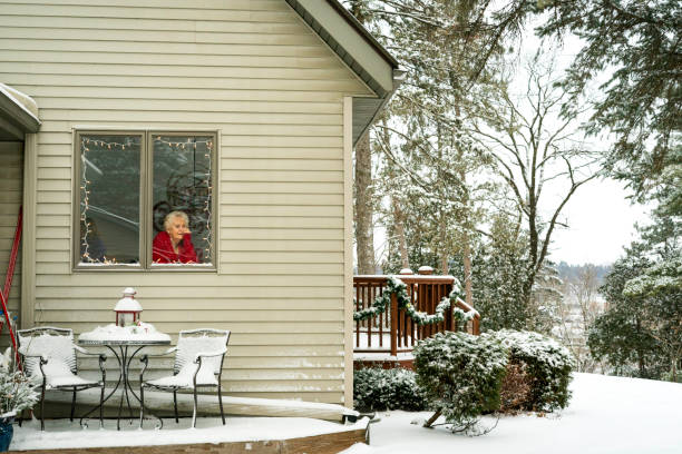 Vast trailer park, mobile home court covered in Winter snow, predawn.