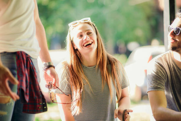 istock YOUNG BEAUTIFUL GIRL US SMILING WHILE SITTING 1367750015