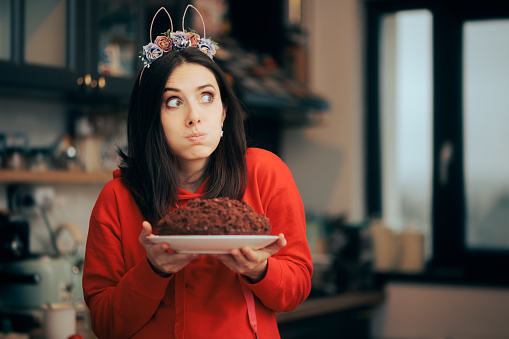Funny party host holding a delicious homemade dessert for spring holidays