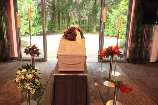 istock A coffin with a flower arrangement in a morgue 1367750101