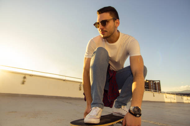 istock One Caucasian man skateboarder skateboarding on rooftop 1367750837