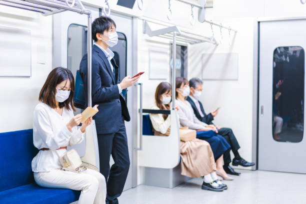 istock People riding the train wearing masks 1367754074