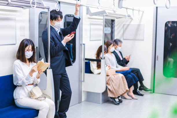 istock People riding the train wearing masks 1367754087