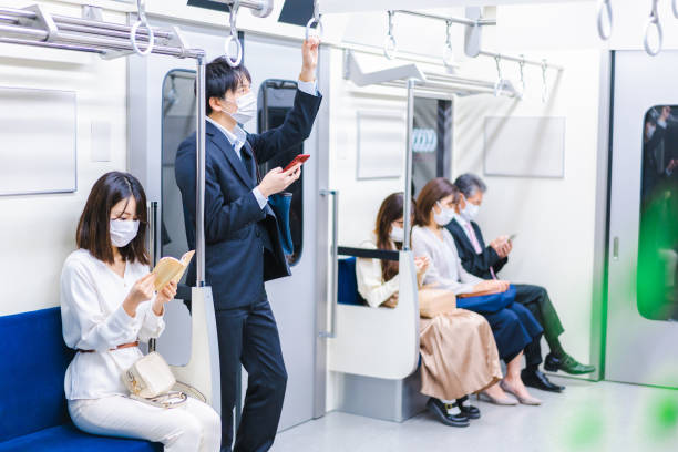 istock People riding the train wearing masks 1367754094