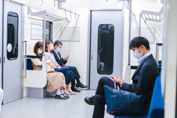 istock People riding the train wearing masks 1367754098