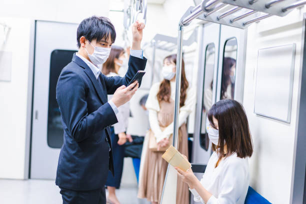 istock People riding the train wearing masks 1367754099
