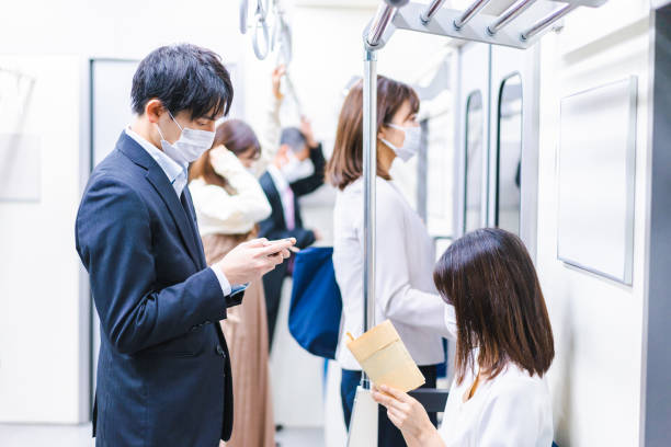 istock People riding the train wearing masks 1367754106