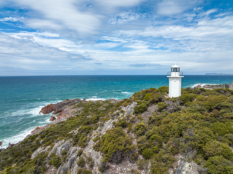 Beautiful high angle aerial drone view of Rocky Cape Lighthouse, part of Rocky Cape National Park, located on the North-West Coast of the island of Tasmania, Australia.