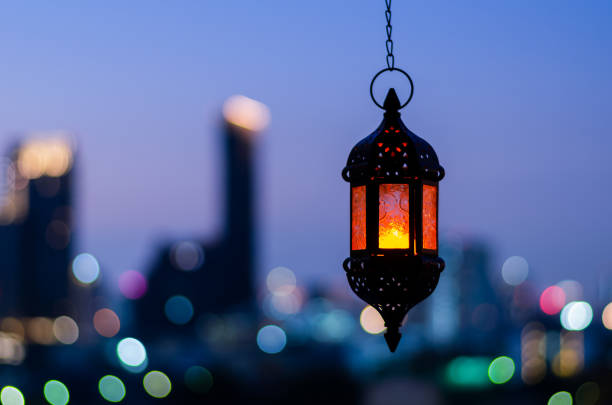 istock Hanging lantern with night sky and city bokeh light background 1367759506