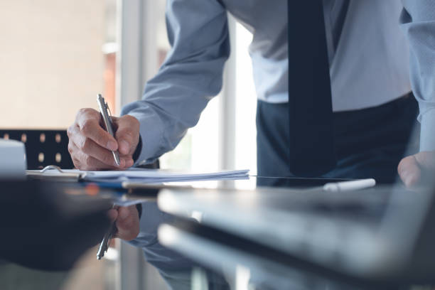 istock Businessman working in office, signing business contract 1367760857