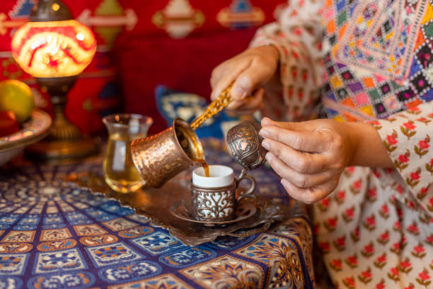 istock Pouring turkish coffee from cezve into cup 1367761828