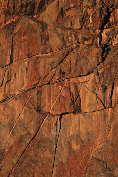 Climbers on the vertical walls of the Black Canyon A climber tackling the vertical walls of the Black Canyon of the Gunnison National Park, Colorado, USA rock face stock pictures, royalty-free photos & images