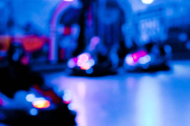 istock Abstract random colourful defocused blurred go-kart cars of fun fair background pattern 1367773476
