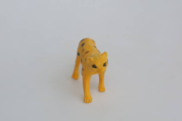 istock Yellow leopard shaped toy made of plastic 1367774998