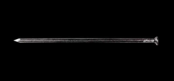 istock steel nail isolated on black background top view 1367776008
