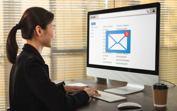 istock Asian business woman using on computer with checking email inbox on website. 1367776823