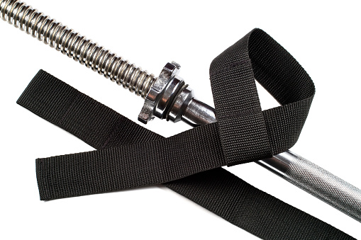 Hand straps for deadlift. Sports belts with a barbell on a white background. Close-up sports accessories.