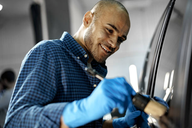 istock African American man car service worker applying nano coating on a car 1367778847