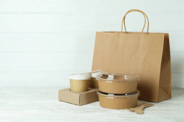 istock Delivery containers for takeaway food on white wooden table 1367779528
