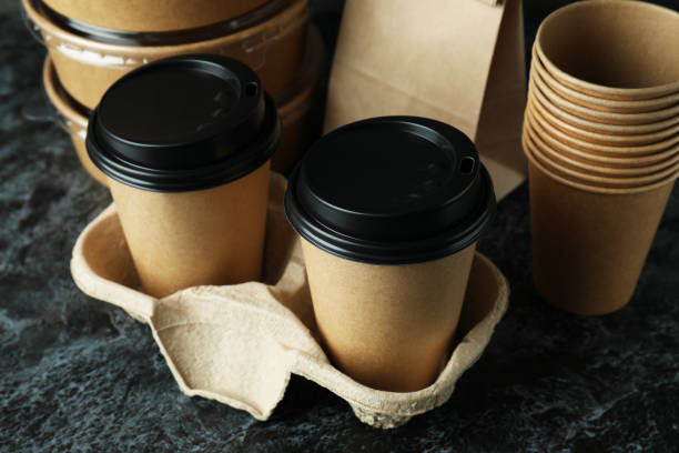 istock Delivery containers for takeaway food on black smokey table 1367779536