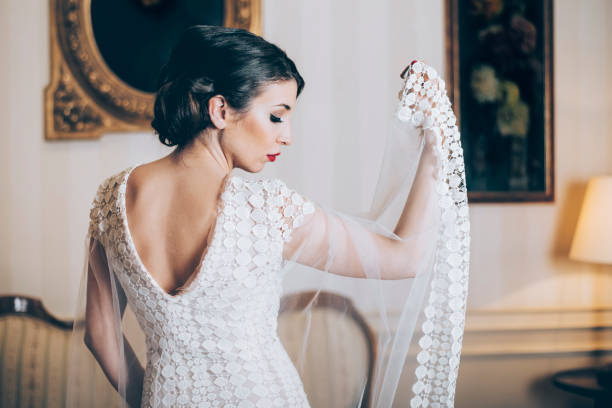 istock Beautiful bride posing in designer wedding dress 1367779704