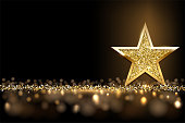 istock Golden sparkling star isolated on dark luxury horizontal background. Vector design element 1367782800
