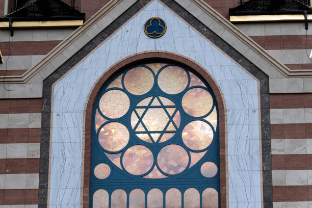 the facade of the synagogue. The star of David is in window. the facade of the synagogue. The star of David is in the window. synagogue photos stock pictures, royalty-free photos & images