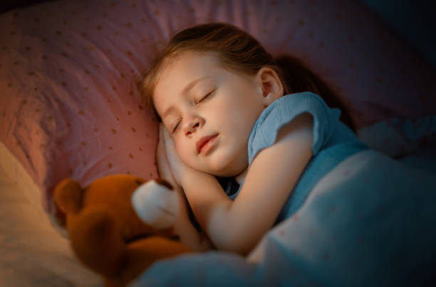 istock child is sleeping in the bed 1367785496