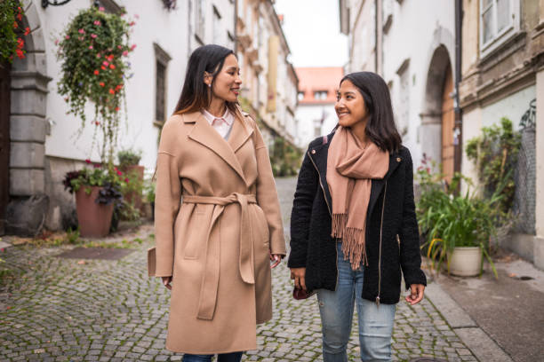 istock Cheerful Female Friends Exploring The City 1367786026
