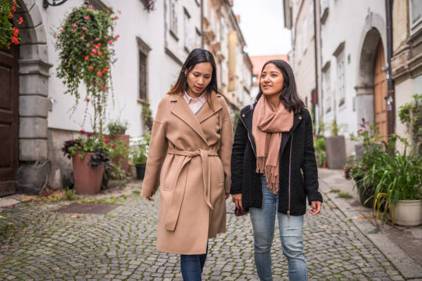 istock Cheerful Female Friends Exploring The City 1367786035
