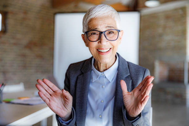 istock Happy mature entrepreneur talking during conference call. 1367786654