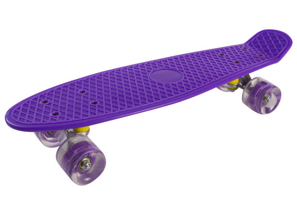 istock purple skateboard with a plastic deck and silicone wheels, on a white background, diagonal arrangement 1367786694
