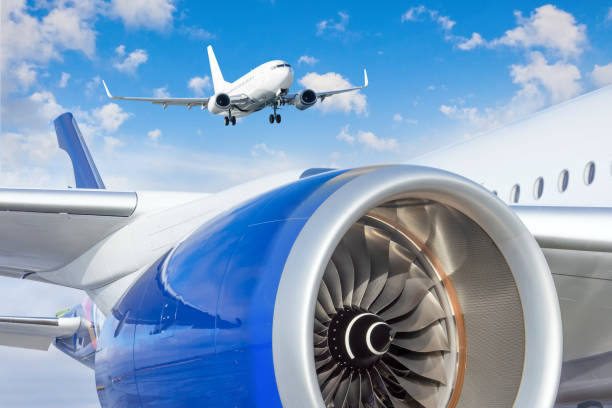 istock Jet engine and a landing plane in the sky. 1367786769
