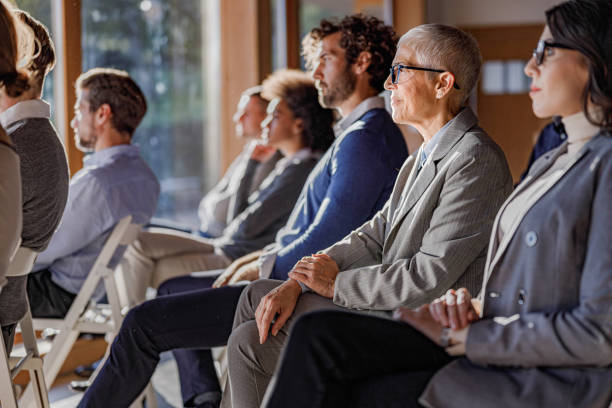 istock Large group of entrepreneurs attending a seminar in board room. 1367786820