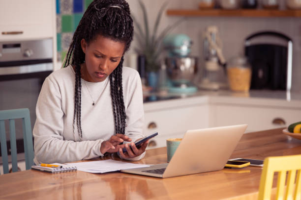 istock Freelance woman calculating a budget. 1367789038