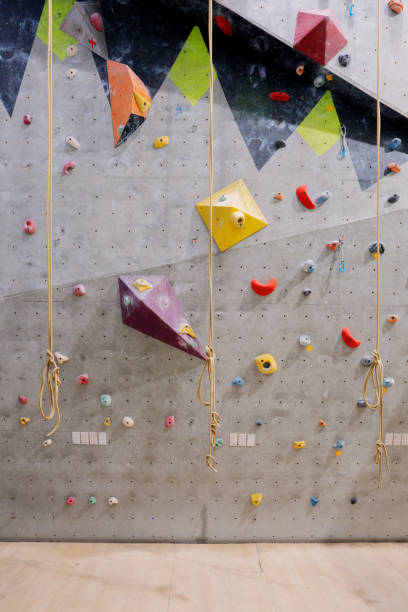 istock Indoor Rock Climbing Wall with Safety Ropes and Holds 1367790981