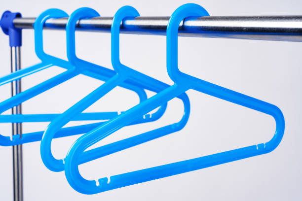 istock Metal rack with clothes hangers on white background 1367792745