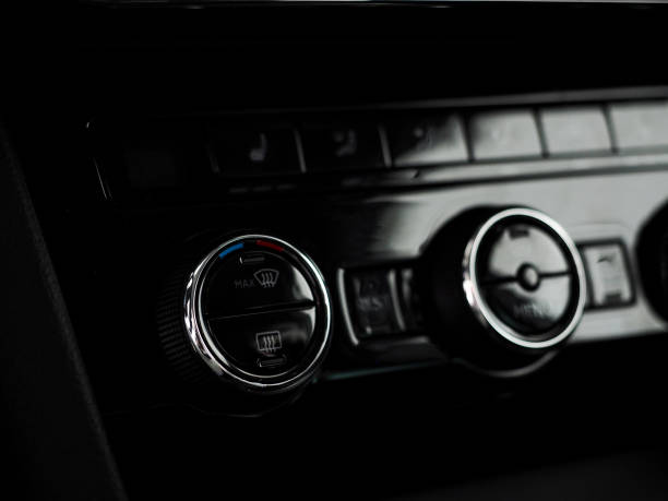 istock car control panel buttons and climate inside a new modern car. stove and air conditioning, climate control works. stylish salon. shallow depth of field 1367793939