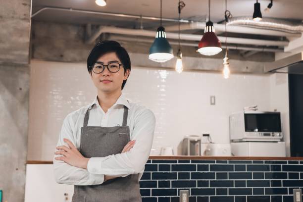 istock Small business owner standing at cafe kitchen 1367794093