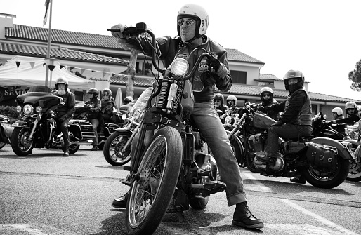 Cecina, Livorno, Tuscany, Italy - May/24/2019: Harley- Davidson meeting in Tuscany, Italy. Biker waiting for parade.