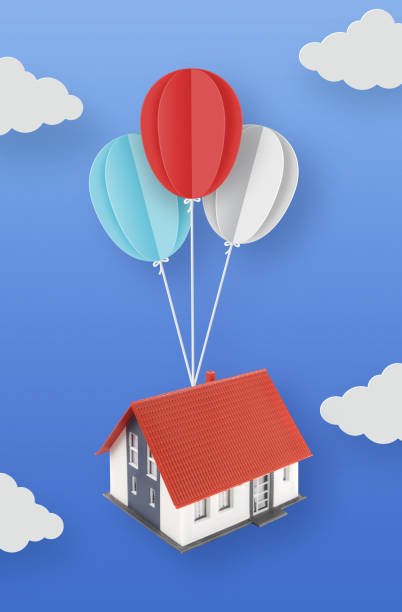 istock Balloons carrying a house 1367797987