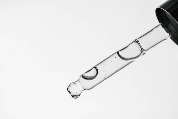 istock Transparent pipette with cosmetics on a white isolated background. 1367800352