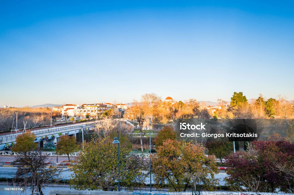 View of the city center of Larissa View of the city center and the bridge of the River Pinios in Larissa. Activity Stock Photo