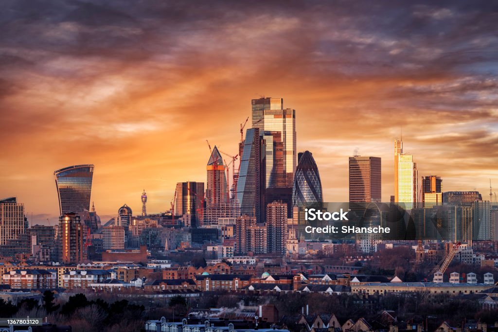 Elevated, panoramic sunrise view of the skyline of London City Elevated, panoramic sunrise view of the skyline of London City with the various modern skyscrapers reflecting the soft morning sunlight London - England Stock Photo