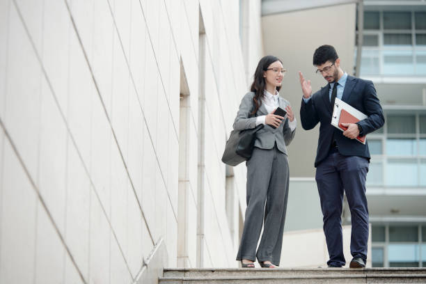 istock Businessman Explaining Idea to Colleague 1367803127