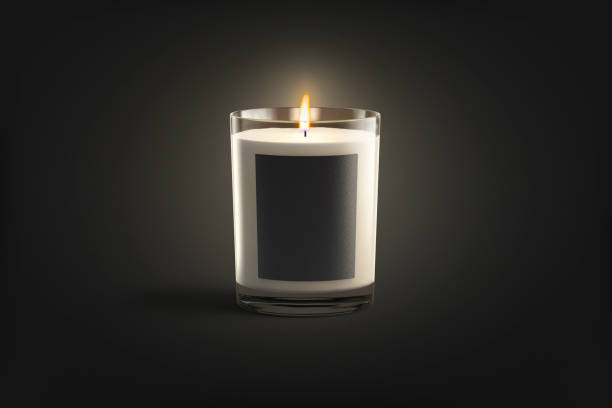 istock Blank burning candle in glass jar with white label mockup 1367803573