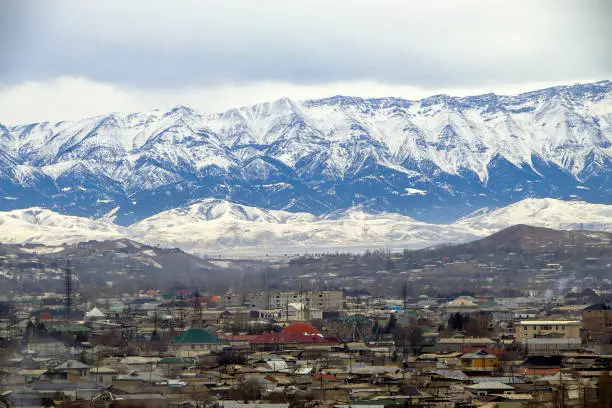 Photo of Winter panorama of Istaravshan and Zeravshan range. Tajikistan