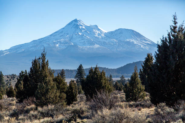 istock Curving road with mountain in the background 1367805135