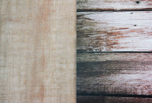 istock brown canvas fabric on wooden background 1367805323