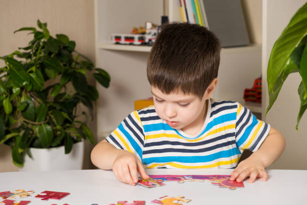 istock A preschooler plays puzzles, puts together a picture 1367805985